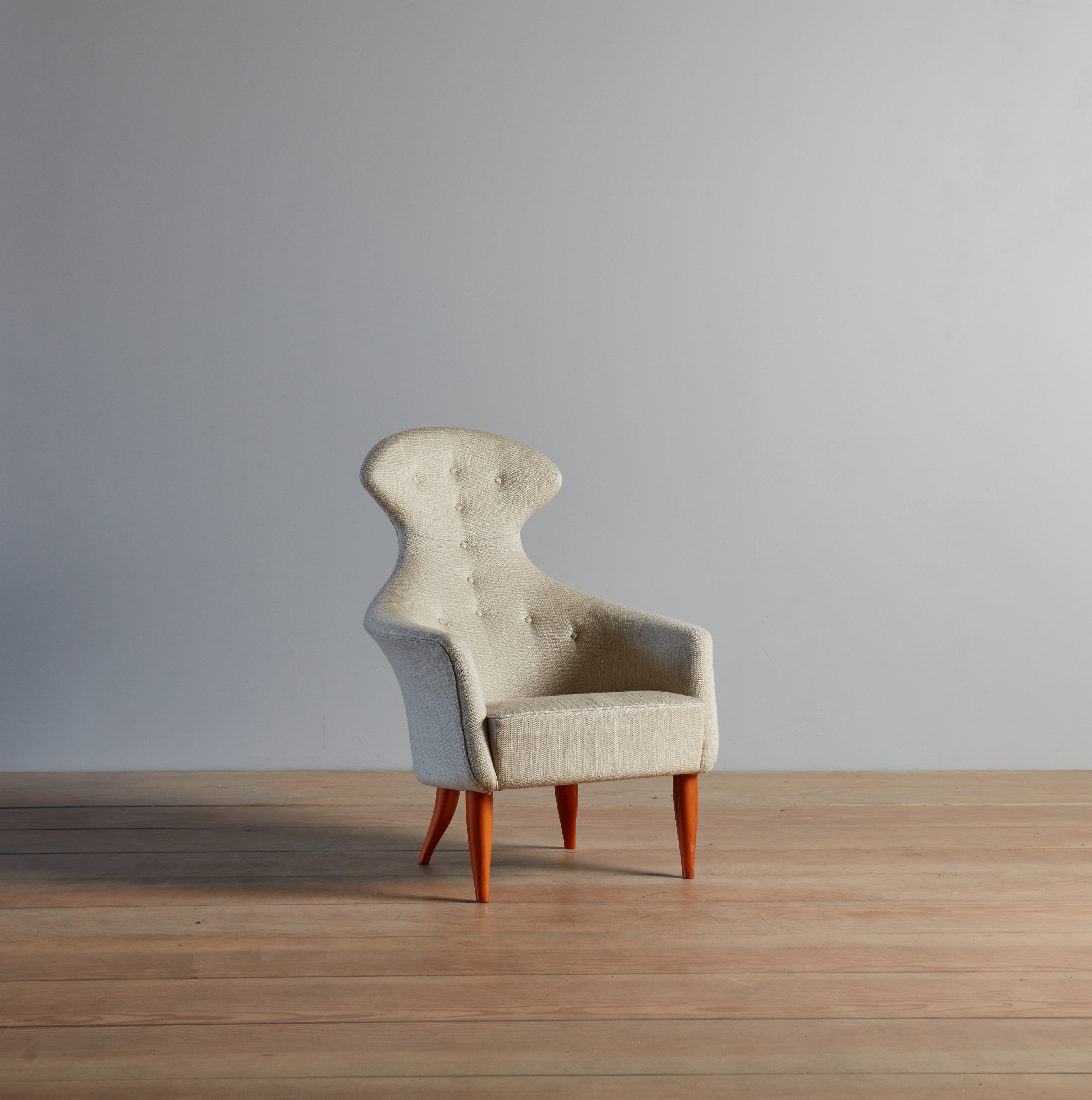 a white chair sitting on top of a wooden floor
