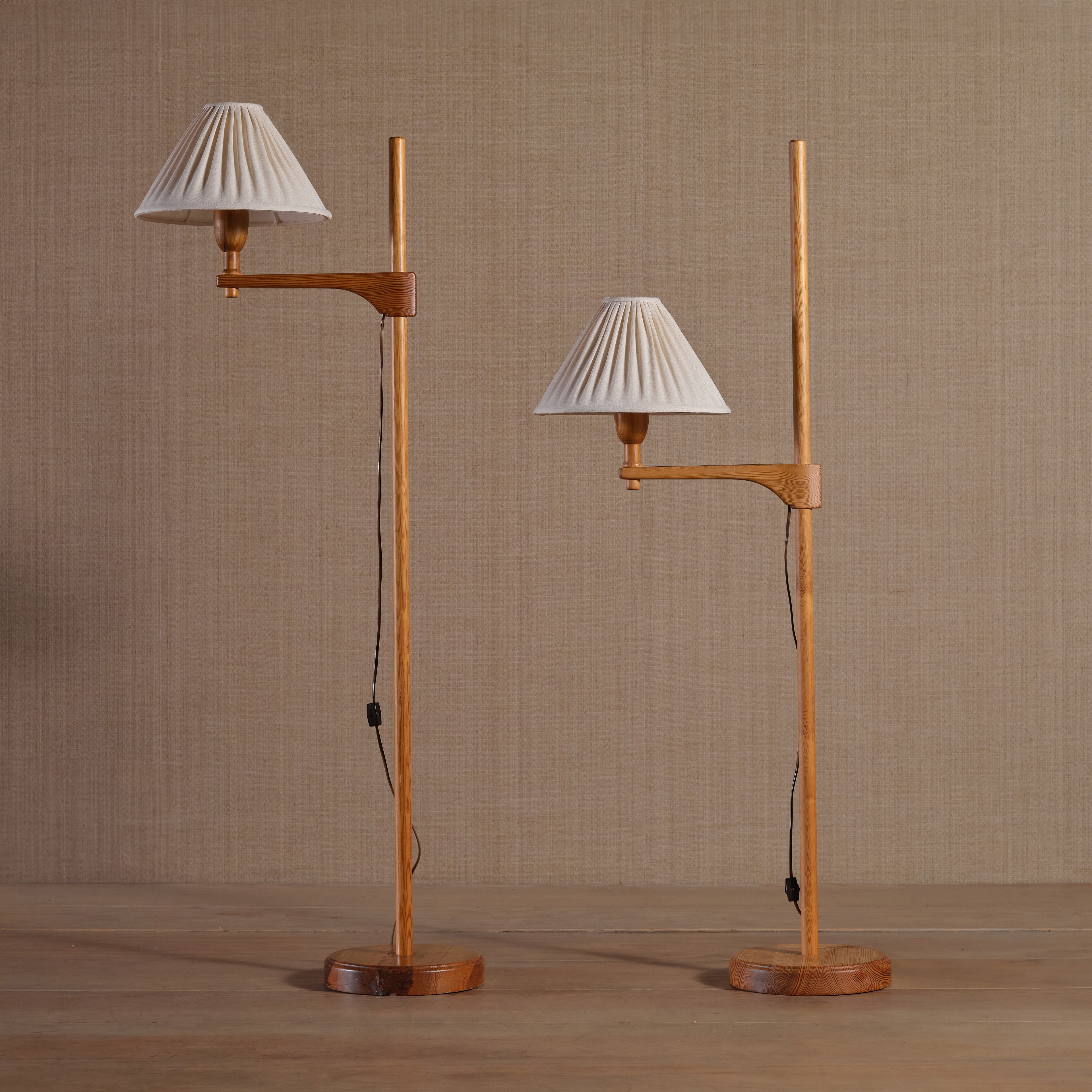 a couple of lamps sitting on top of a wooden floor