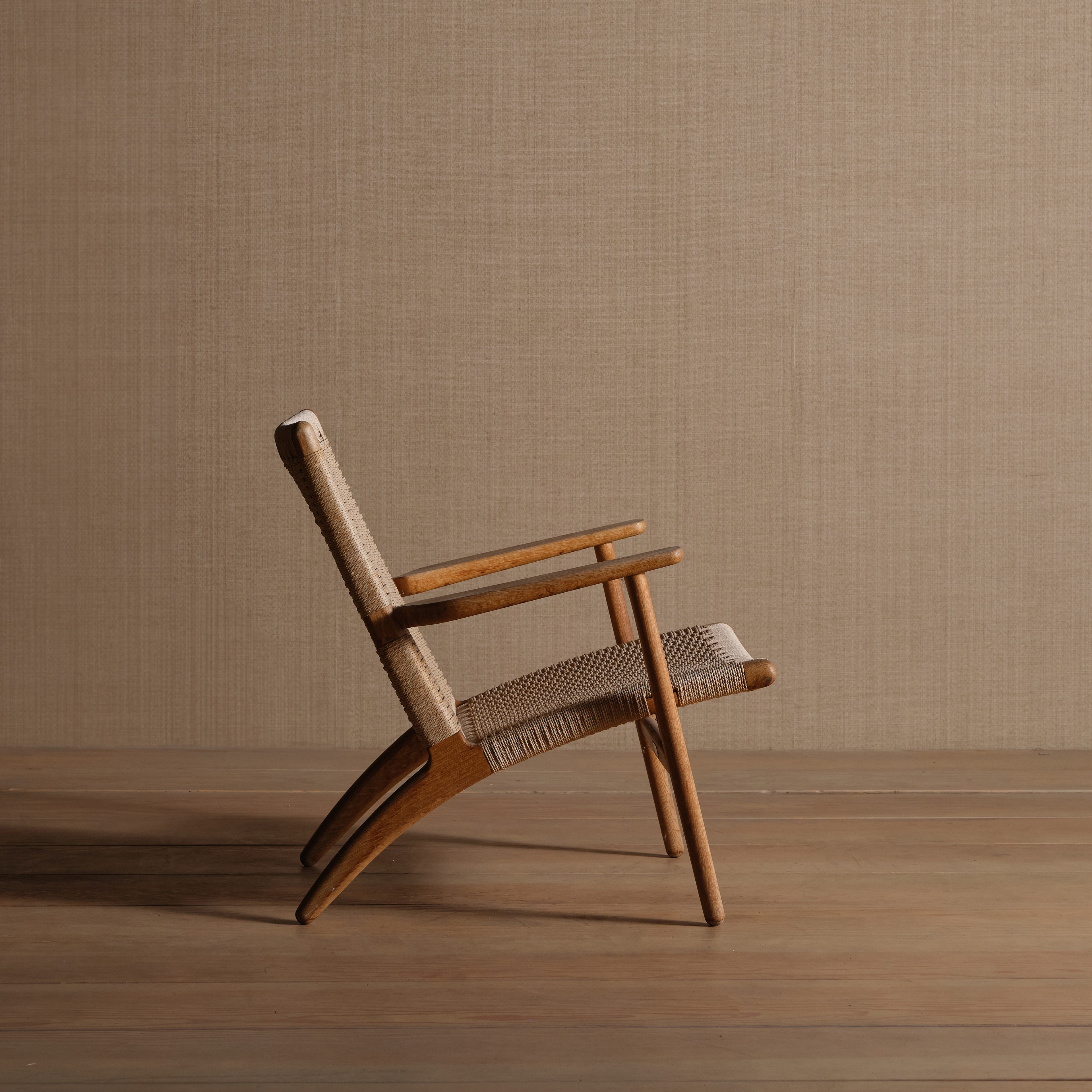 a wooden chair sitting on top of a wooden floor