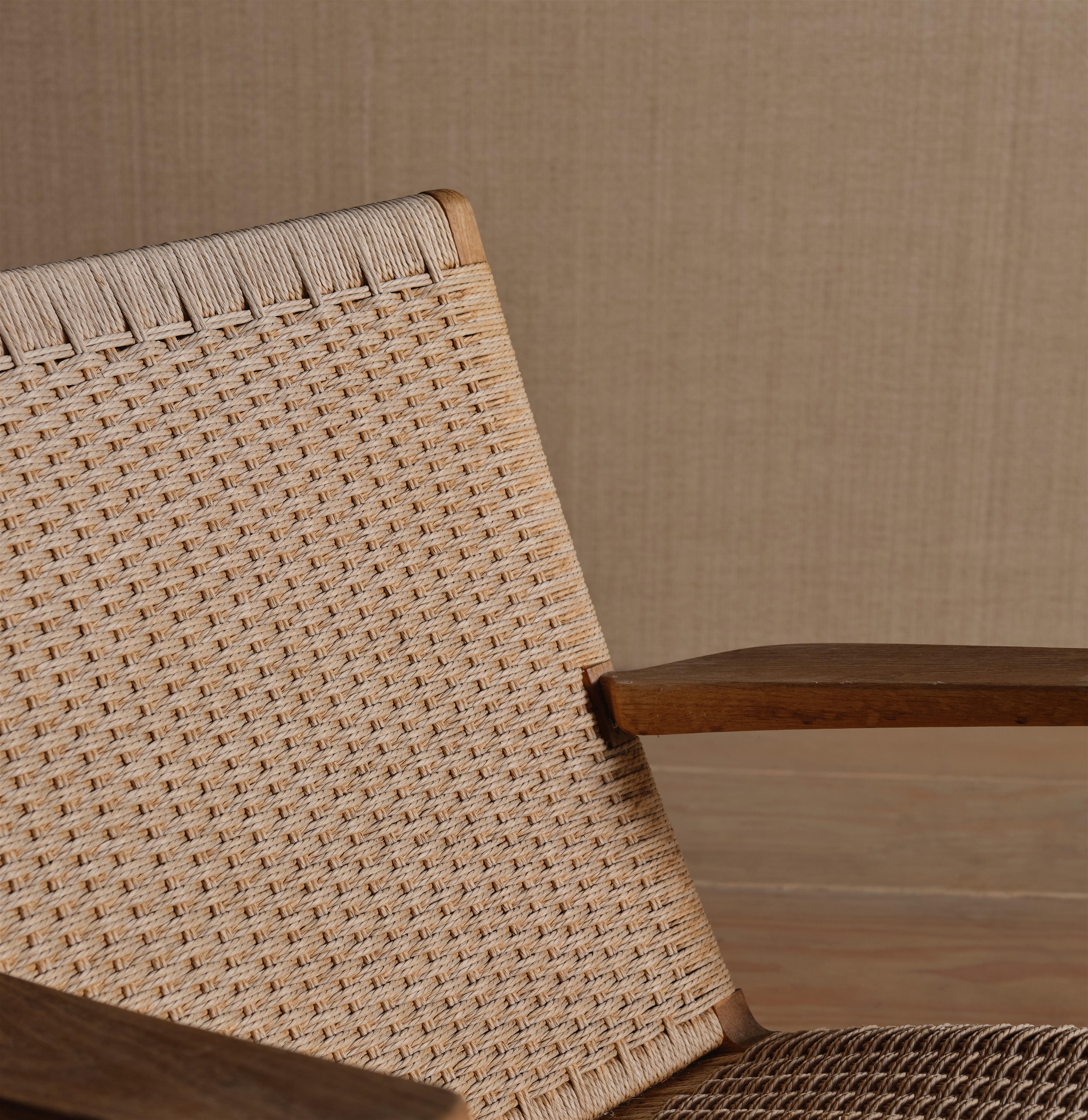a close up of a chair with a wooden frame
