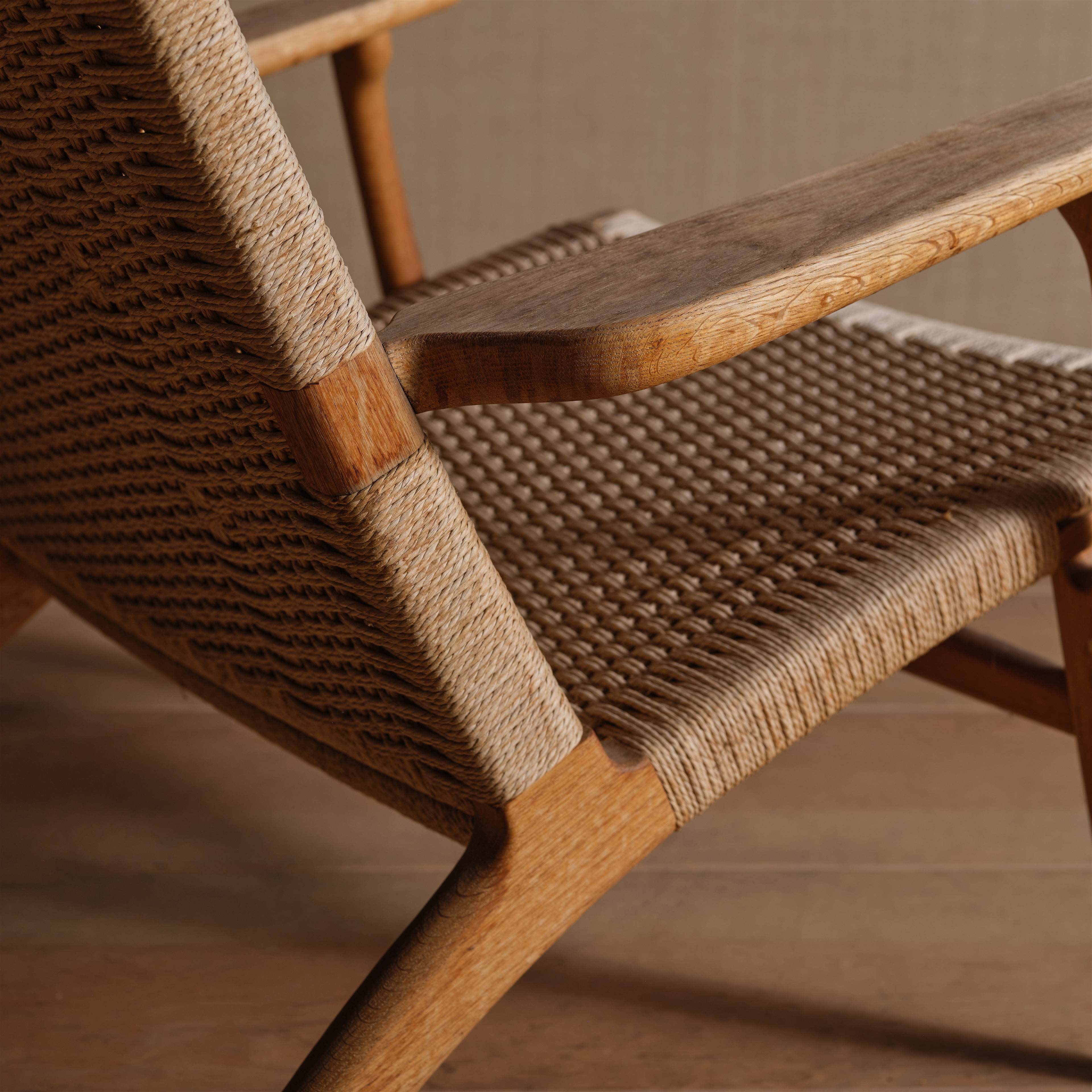 a close up of a wooden chair on a wooden floor