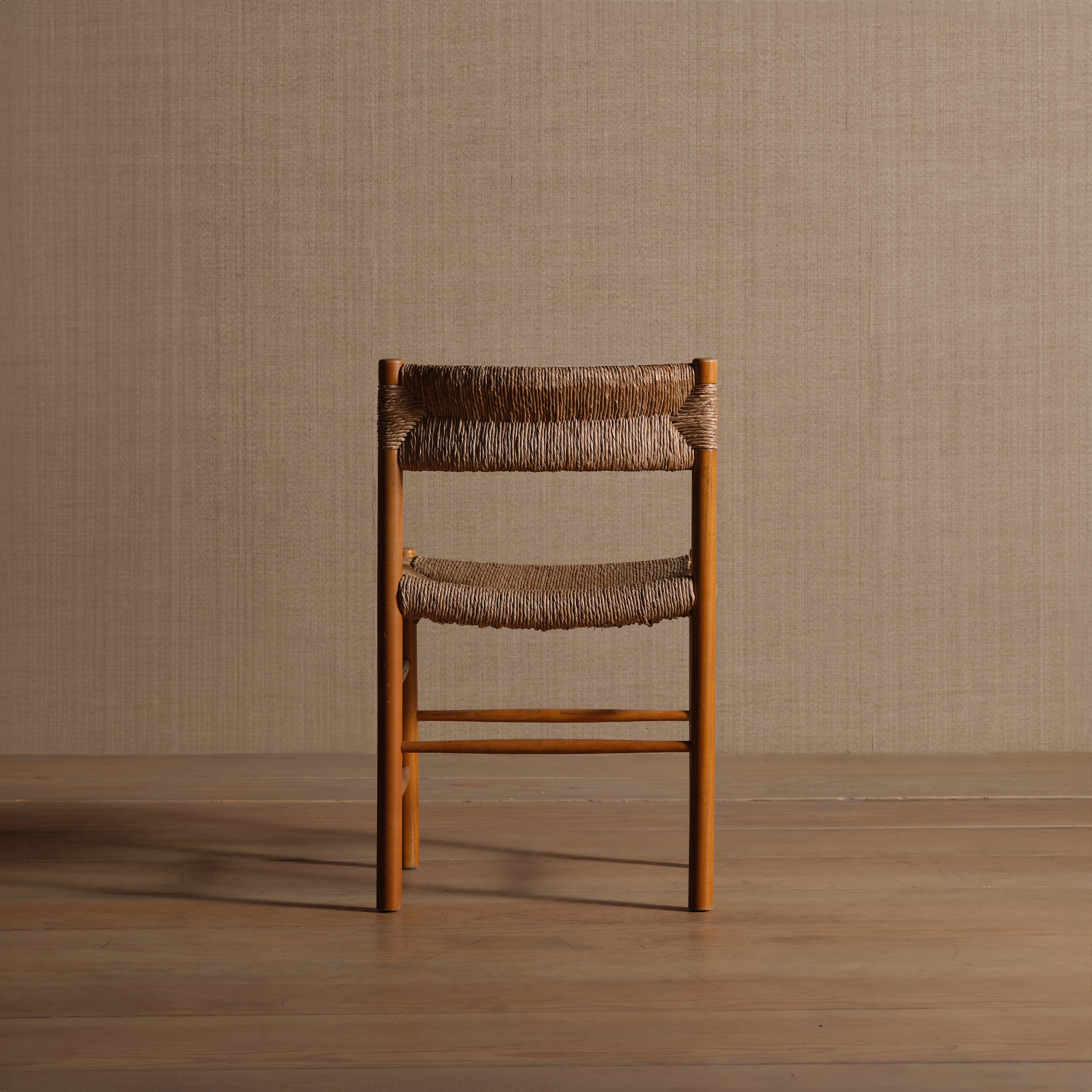 a wooden chair sitting on top of a wooden floor