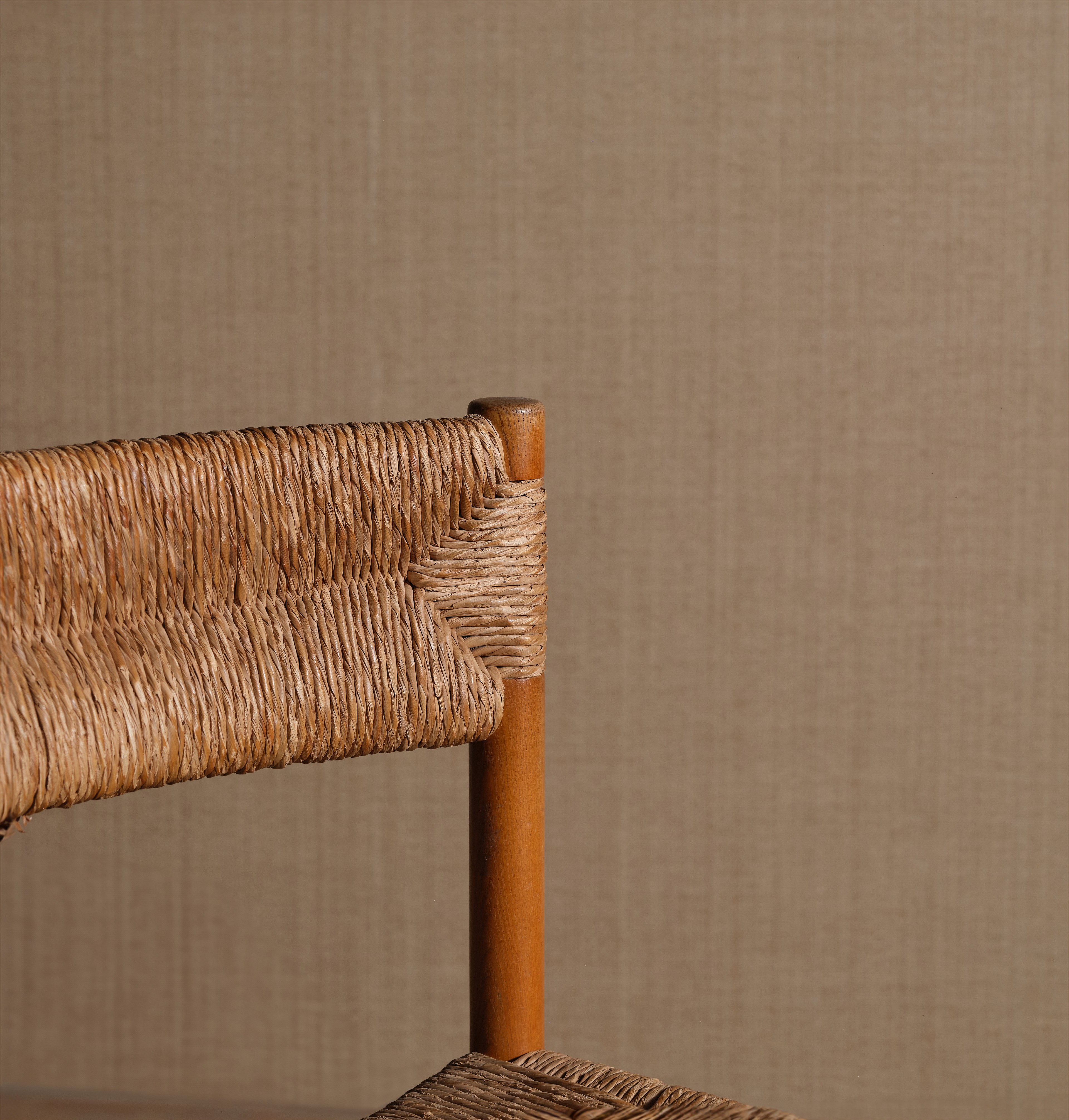 a close up of a chair with a wooden frame