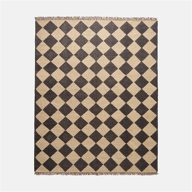 a black and white rug with a checkerboard pattern