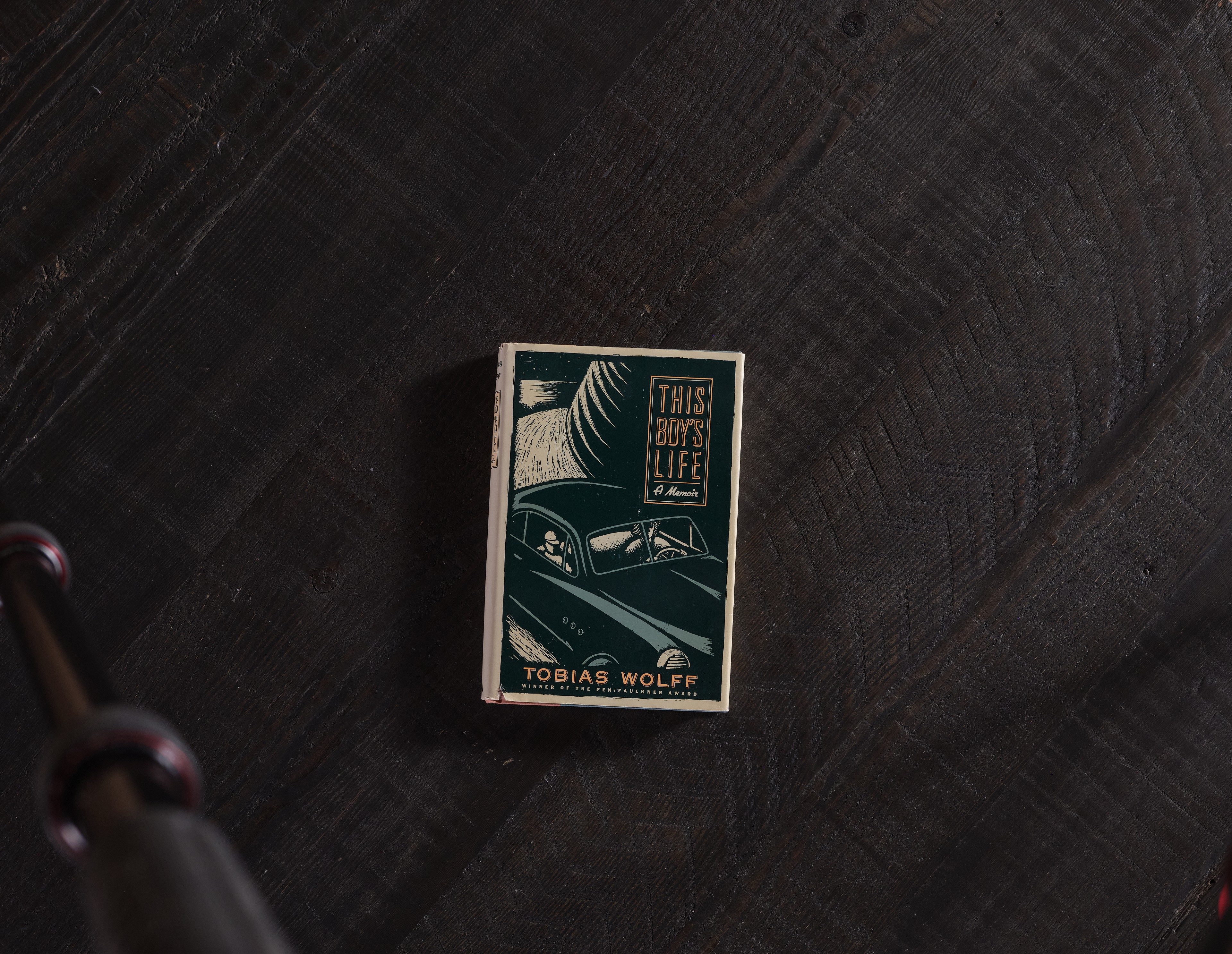 a match card sitting on top of a wooden table