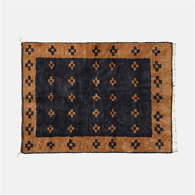 a black and brown rug on a white background