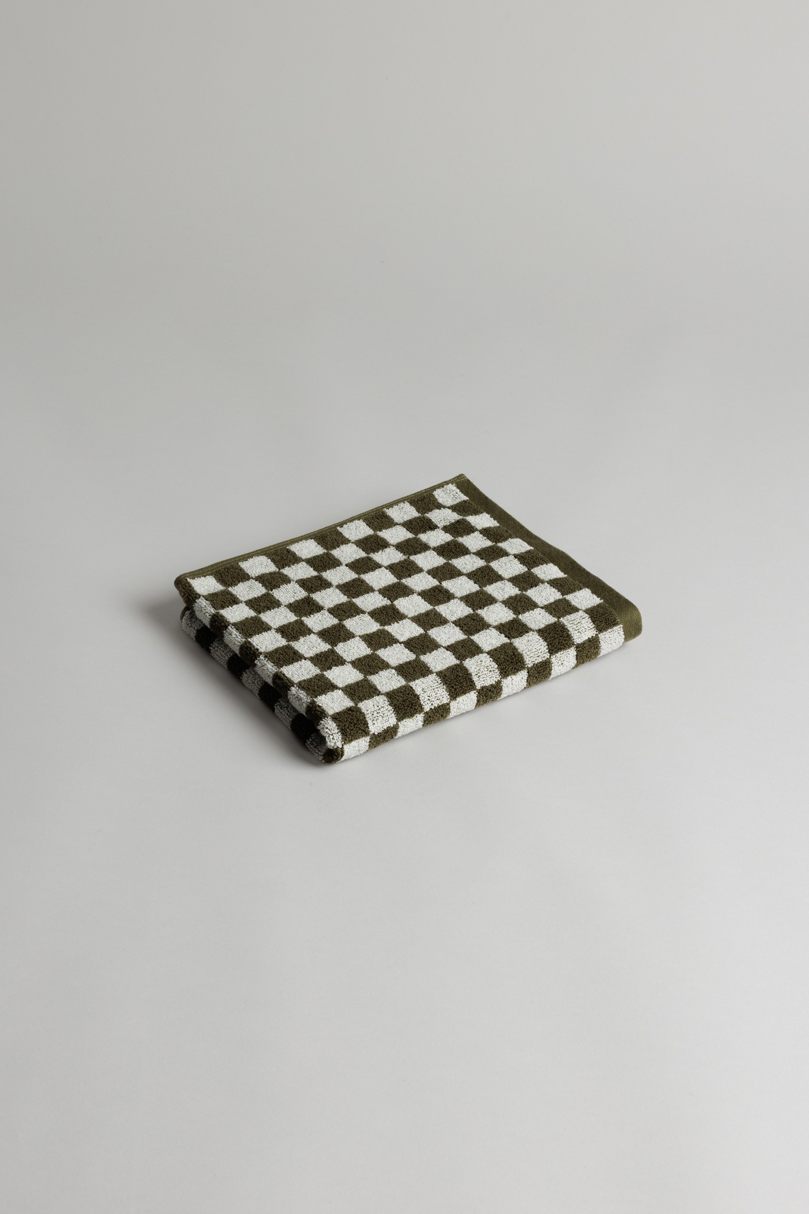a black and white checkered napkin on a white surface