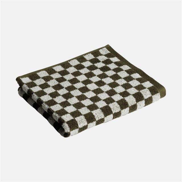 a black and white checkered towel on a white background