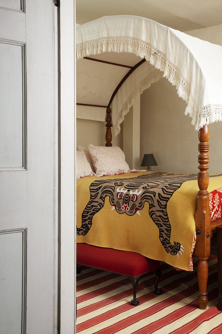 a bed with a canopy with a tiger on it