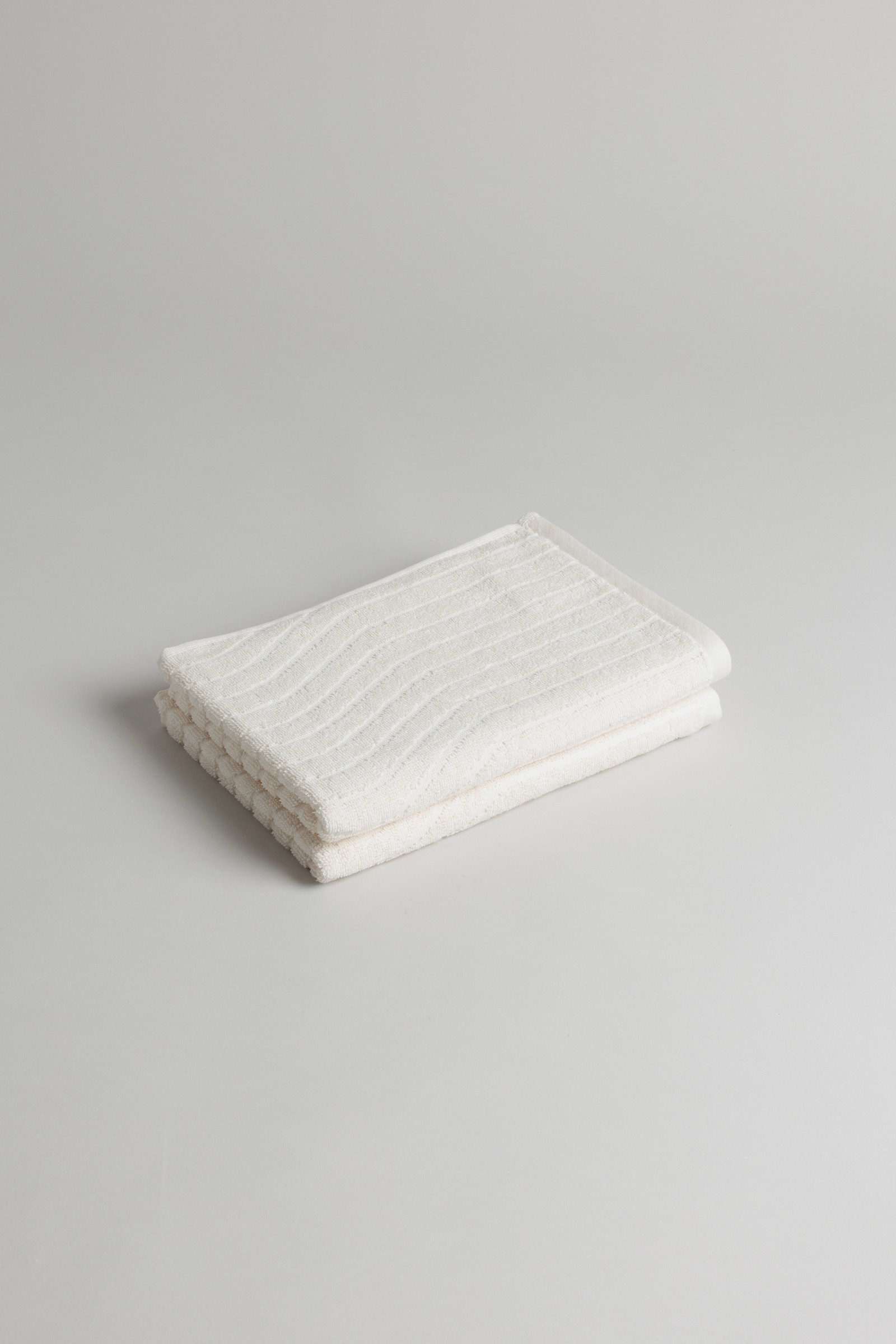 a white towel folded on top of a table
