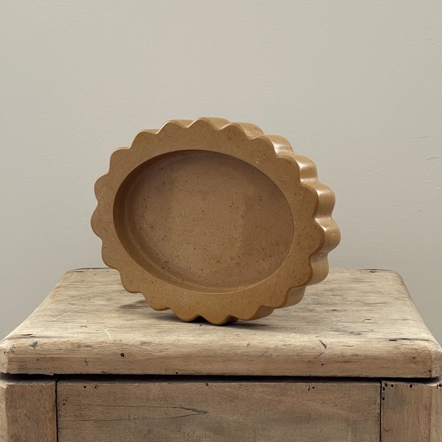 a wooden box with a bowl on top of it