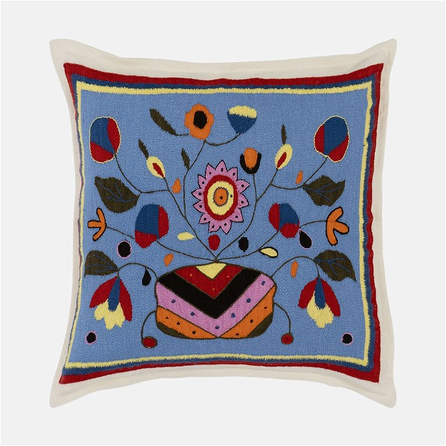 a blue pillow with a colorful design on it