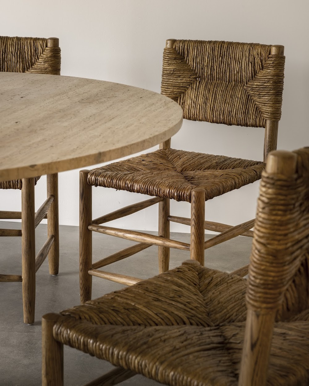 a table and chairs made of wood and wicker