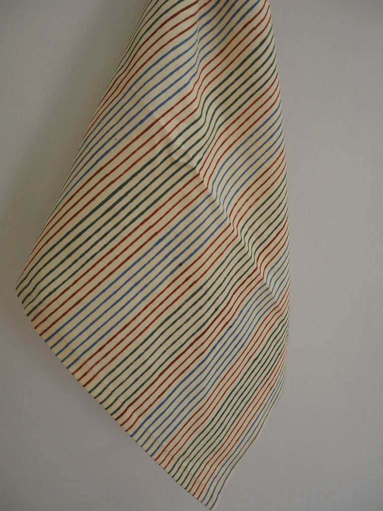 a close up of a tie hanging on a wall