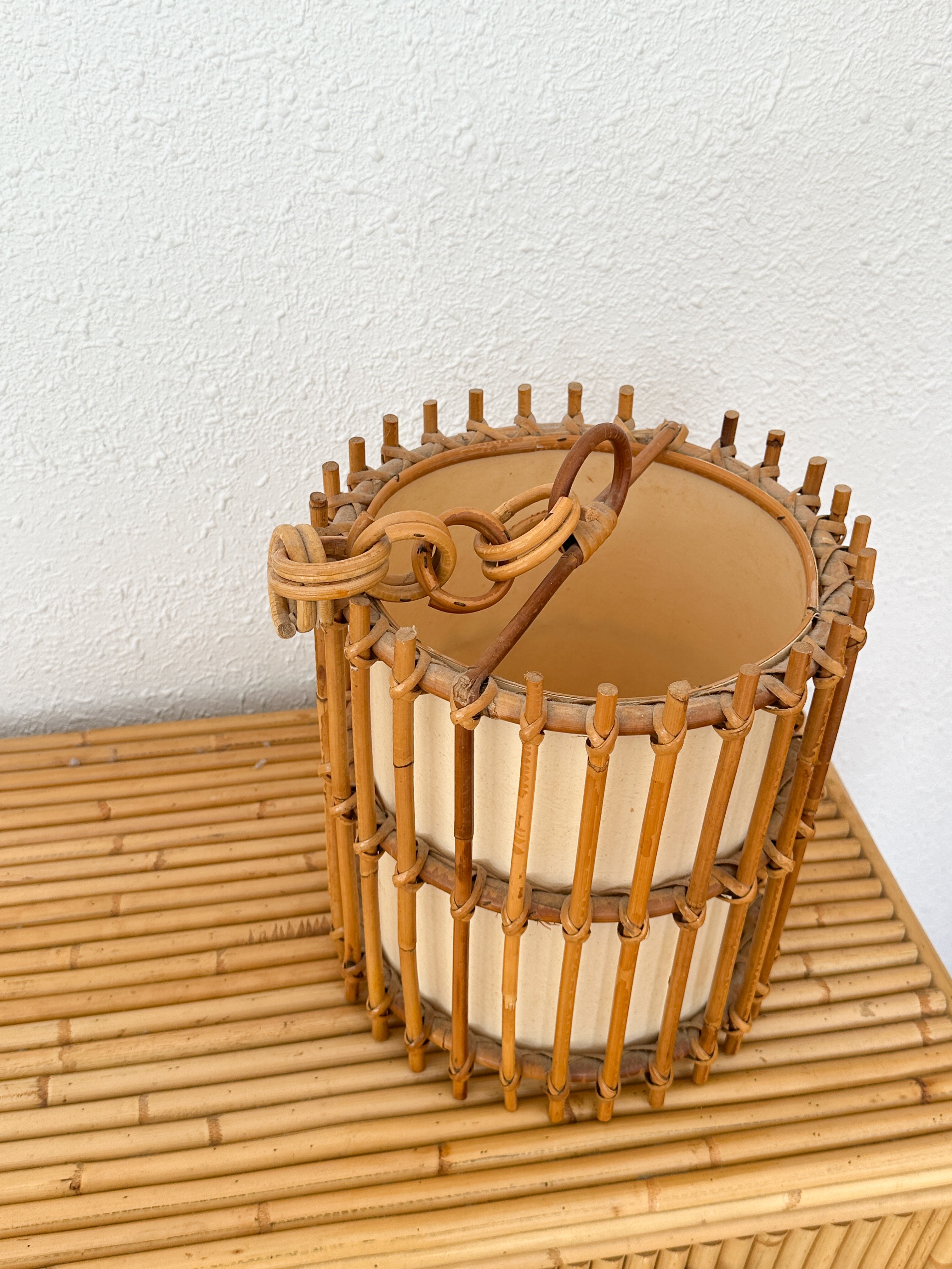 a bamboo basket sitting on top of a wooden table
