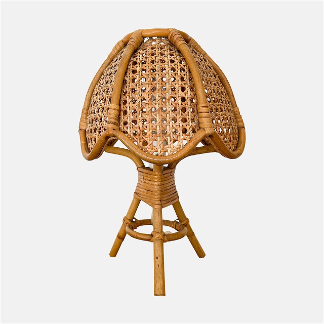 a wicker stool with a seat on top of it