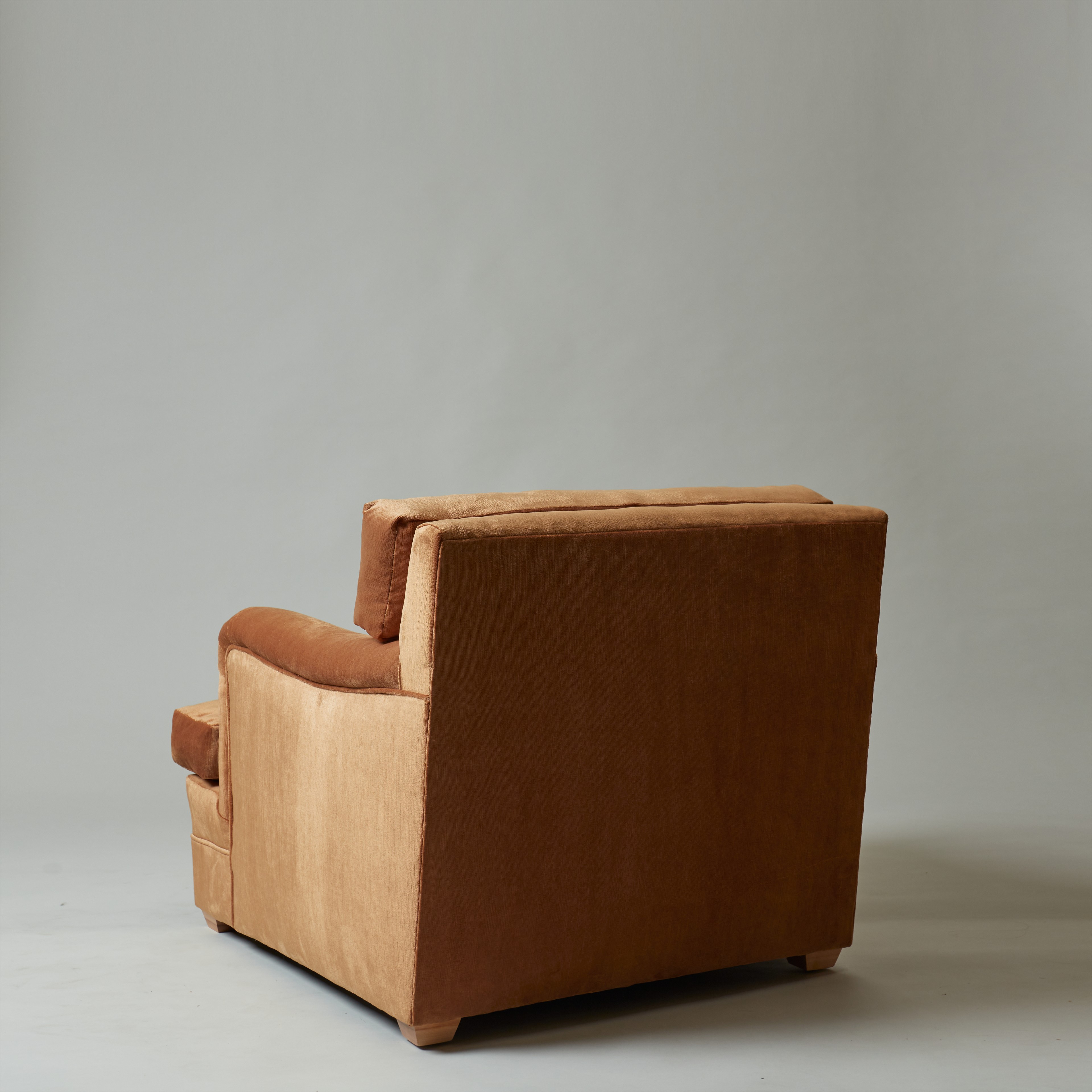 a brown chair sitting on top of a white floor