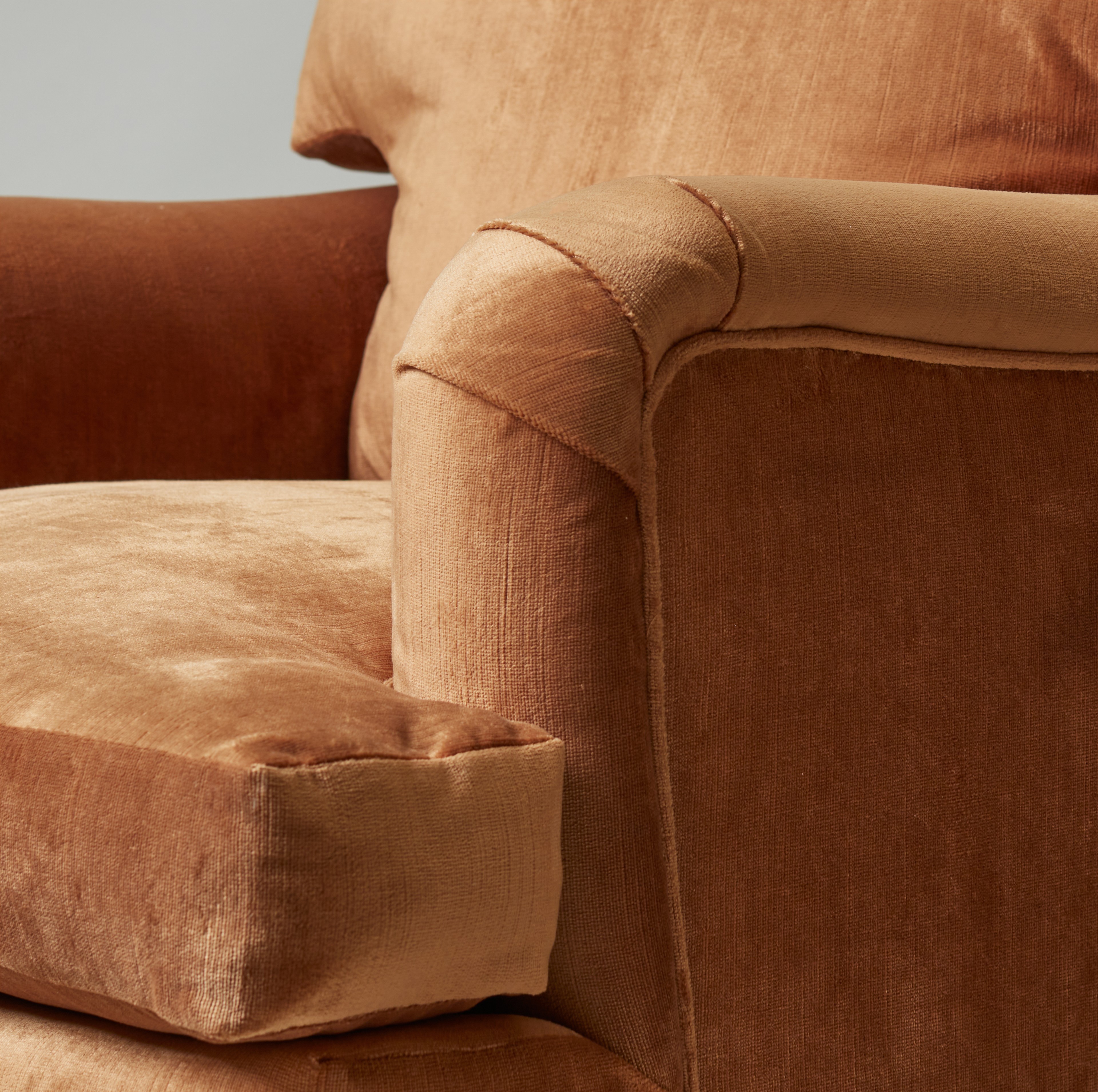 a close up of a chair with a footstool