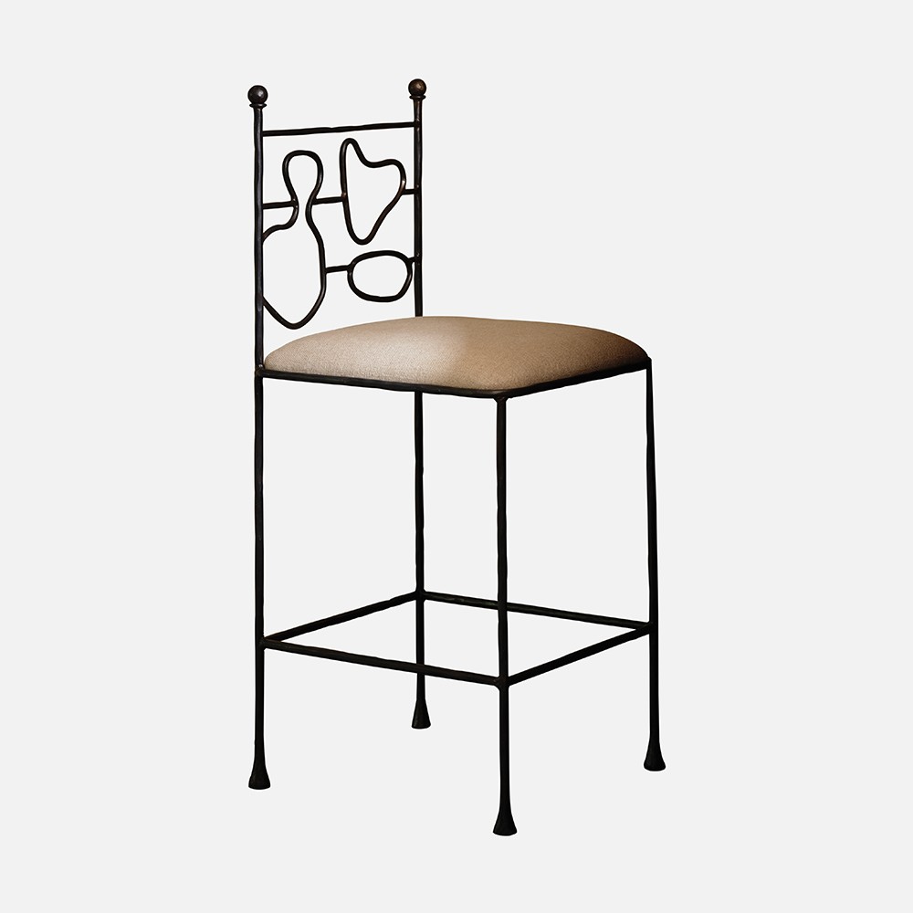 a black metal chair with a beige seat