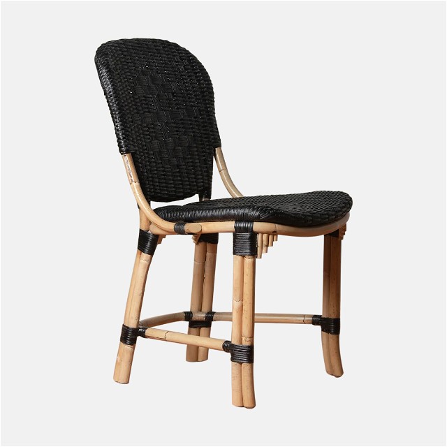 a wooden chair with a black seat on a white background