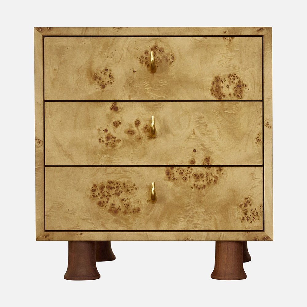 a wooden chest of drawers with brass knobs