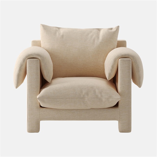 a beige chair with a pillow on top of it