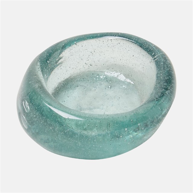 a glass bowl sitting on top of a white table