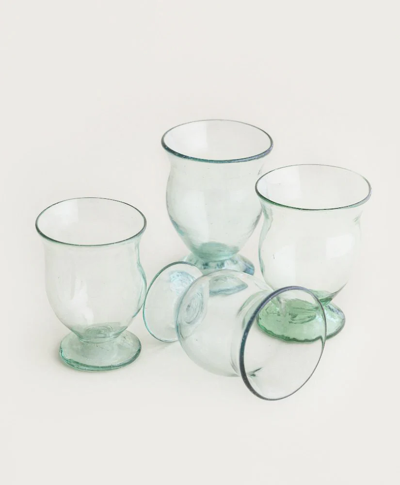a group of glass cups sitting next to each other