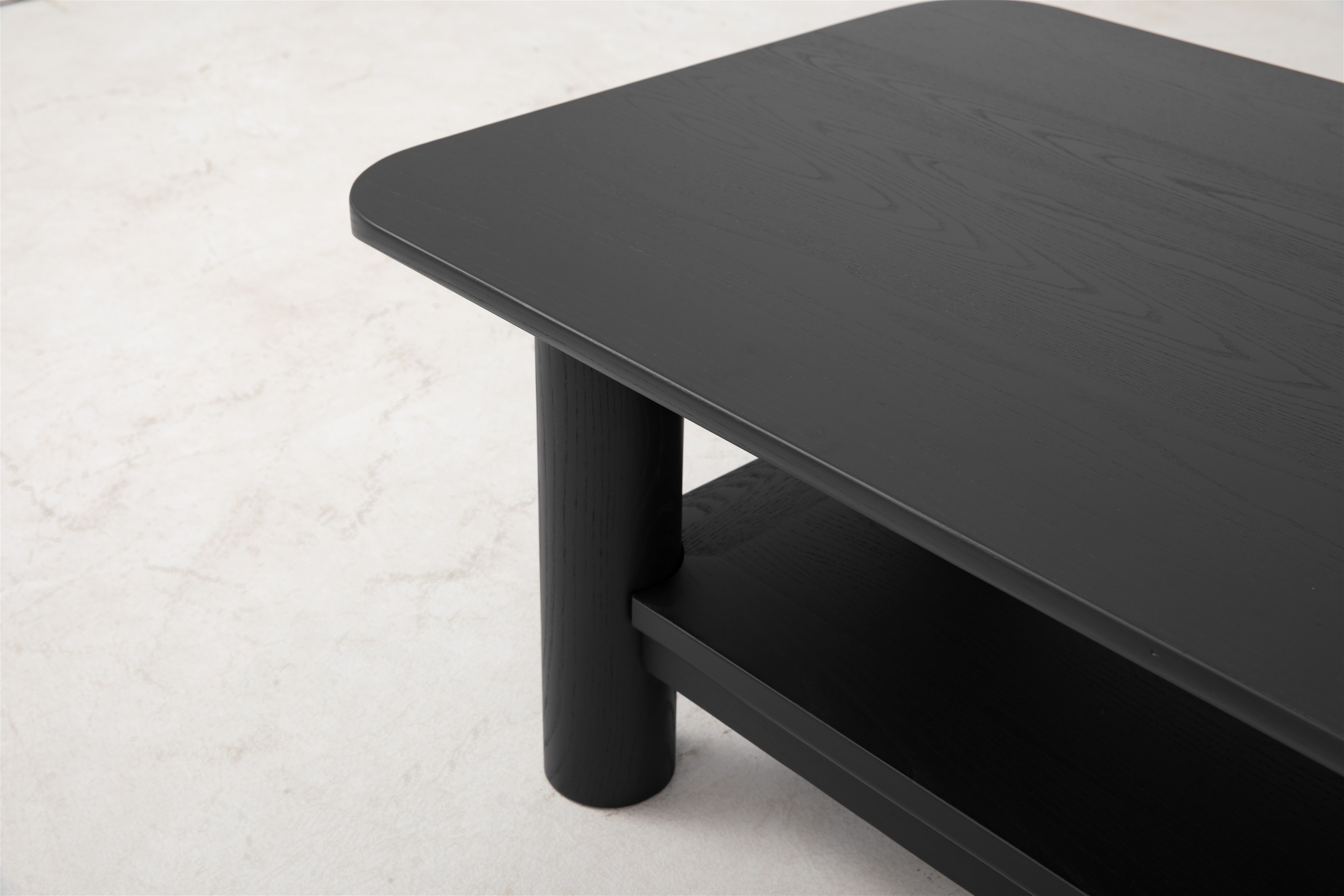 a close up of a black table on a white floor