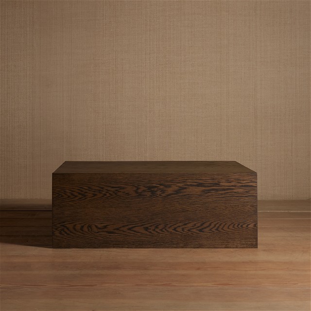 a wooden box sitting on top of a wooden floor