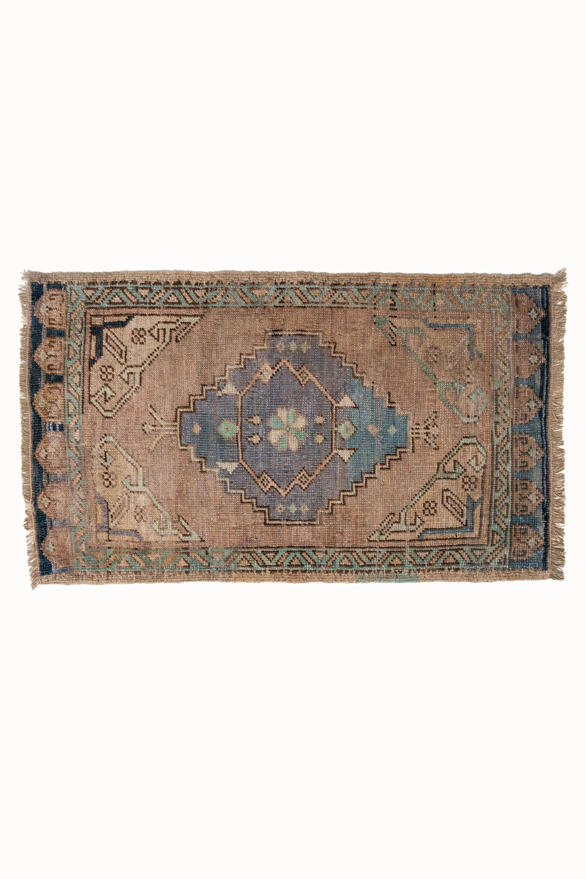 a rug with a blue and beige design on it