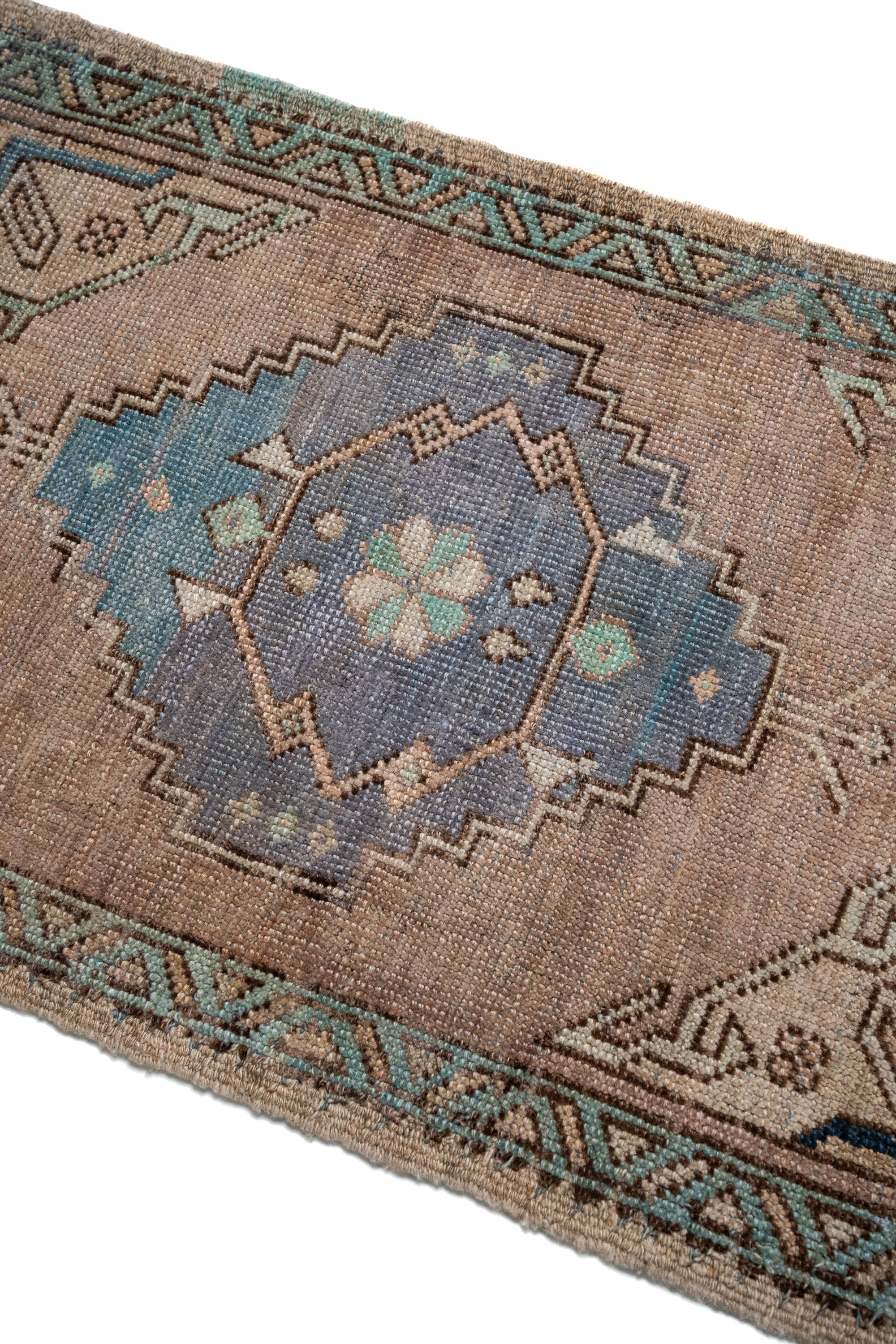 a rug with a blue and brown design on it