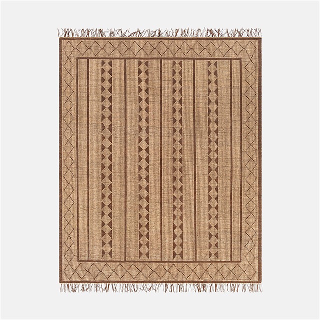 a brown rug with fringes on top of it