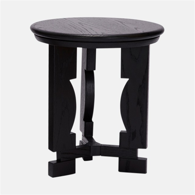 a small black table with a circular top