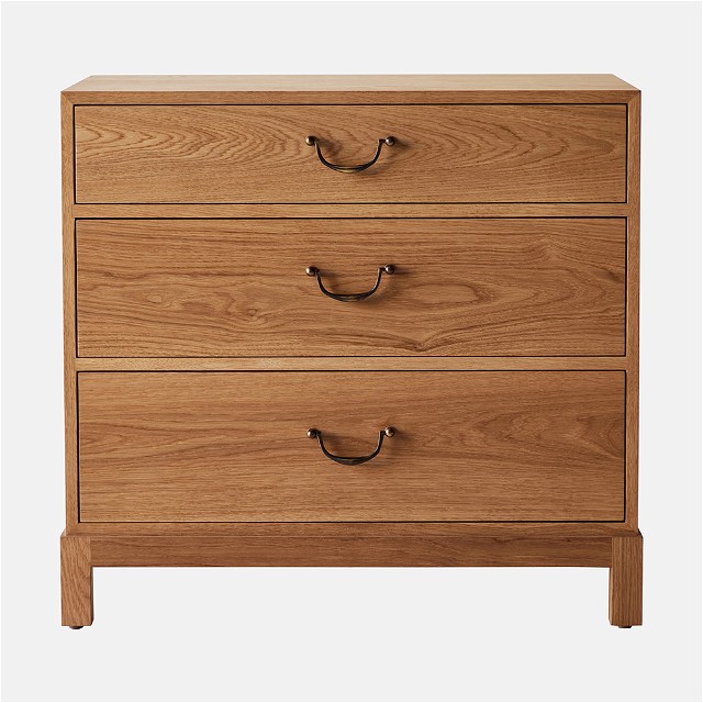 a wooden chest of drawers with two handles