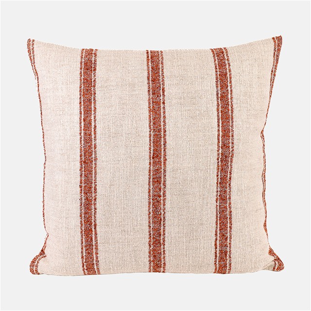 a red and white striped pillow on a white background