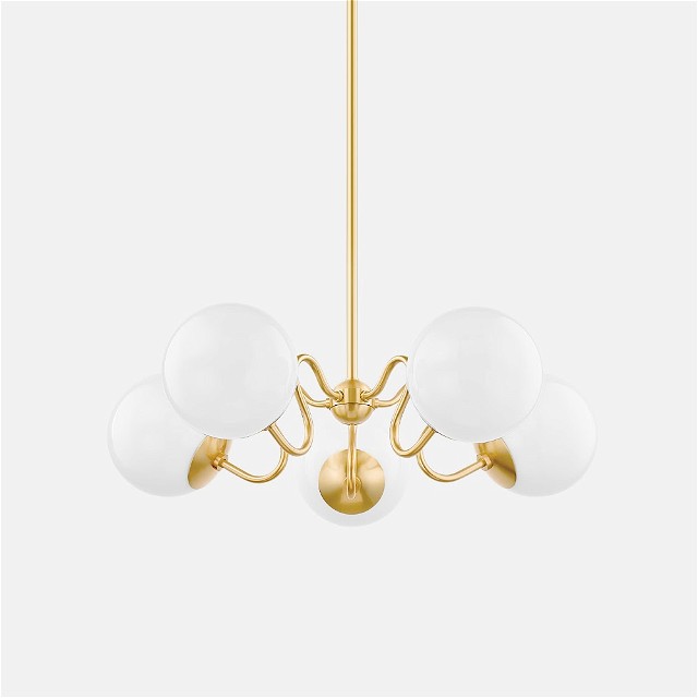 a brass chandelier with five white glass balls