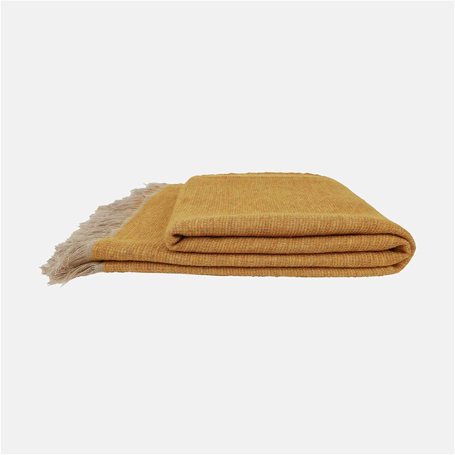 a mustard colored blanket with a white background