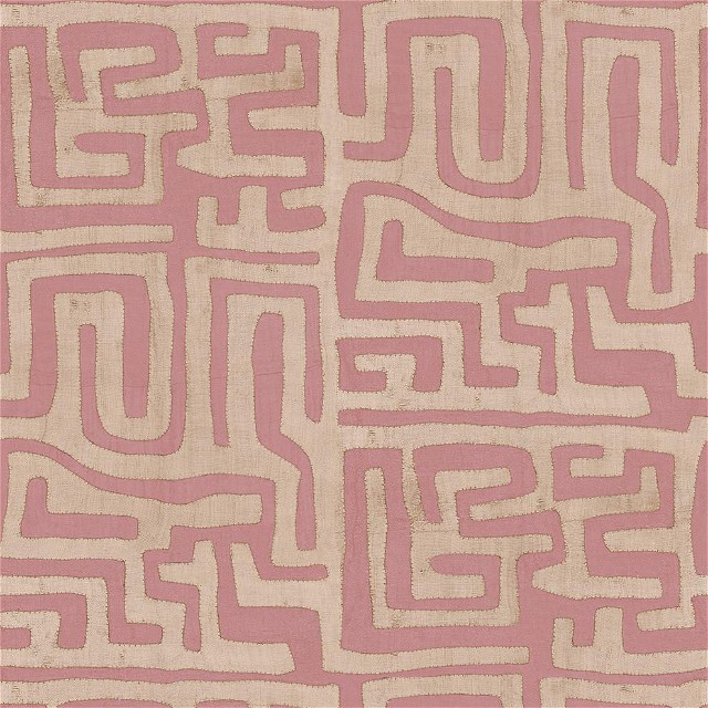 a pink and beige rug with a maze design on it