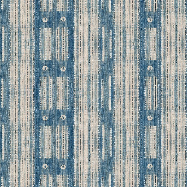 a blue and white striped fabric with circles