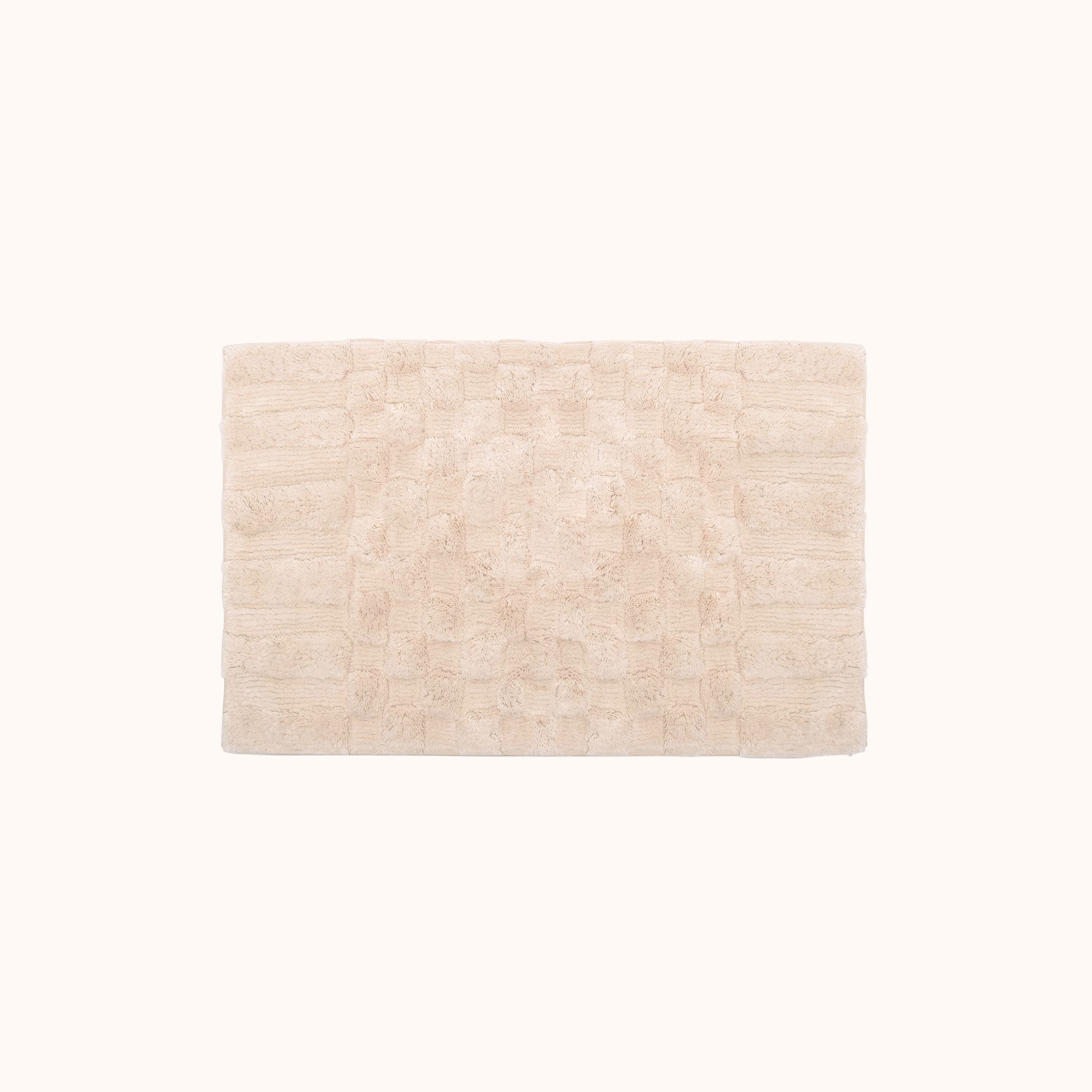 a white rug on a white background