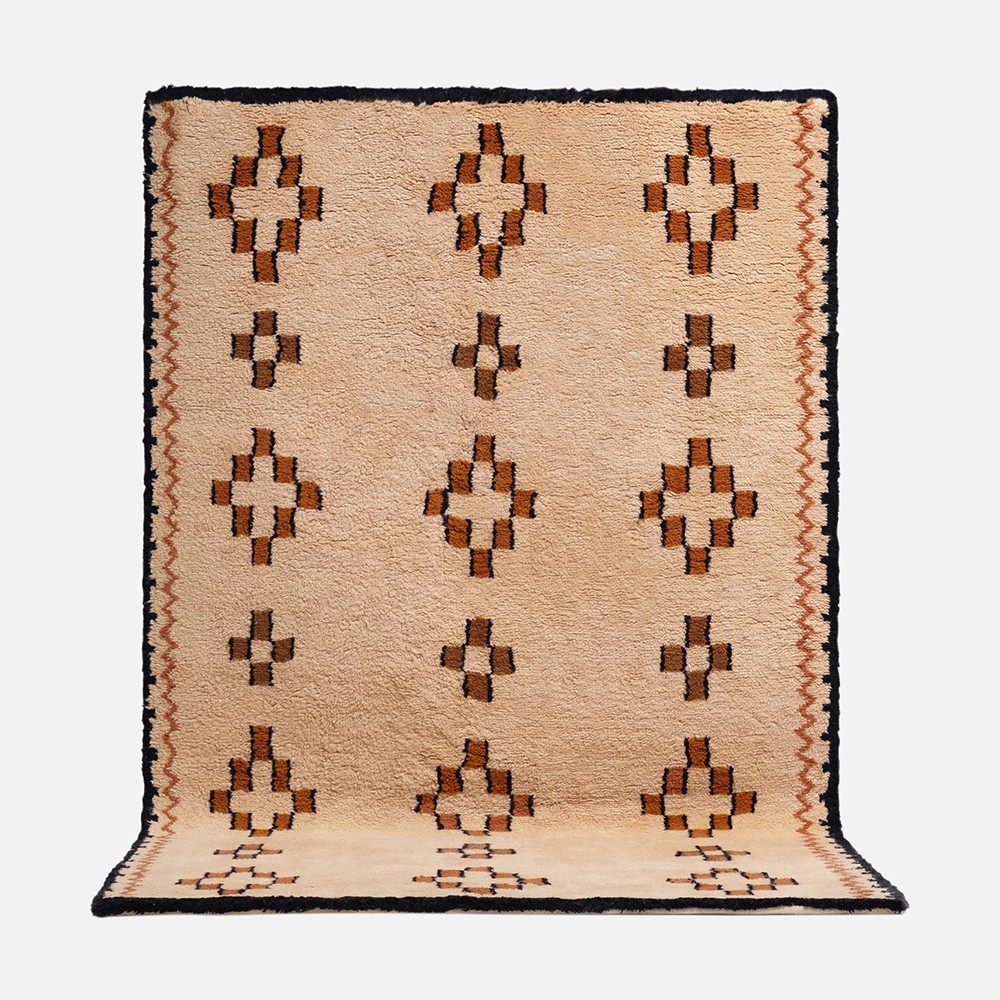 a rug with a cross design on it