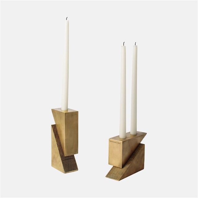 a couple of candles that are in some kind of holder