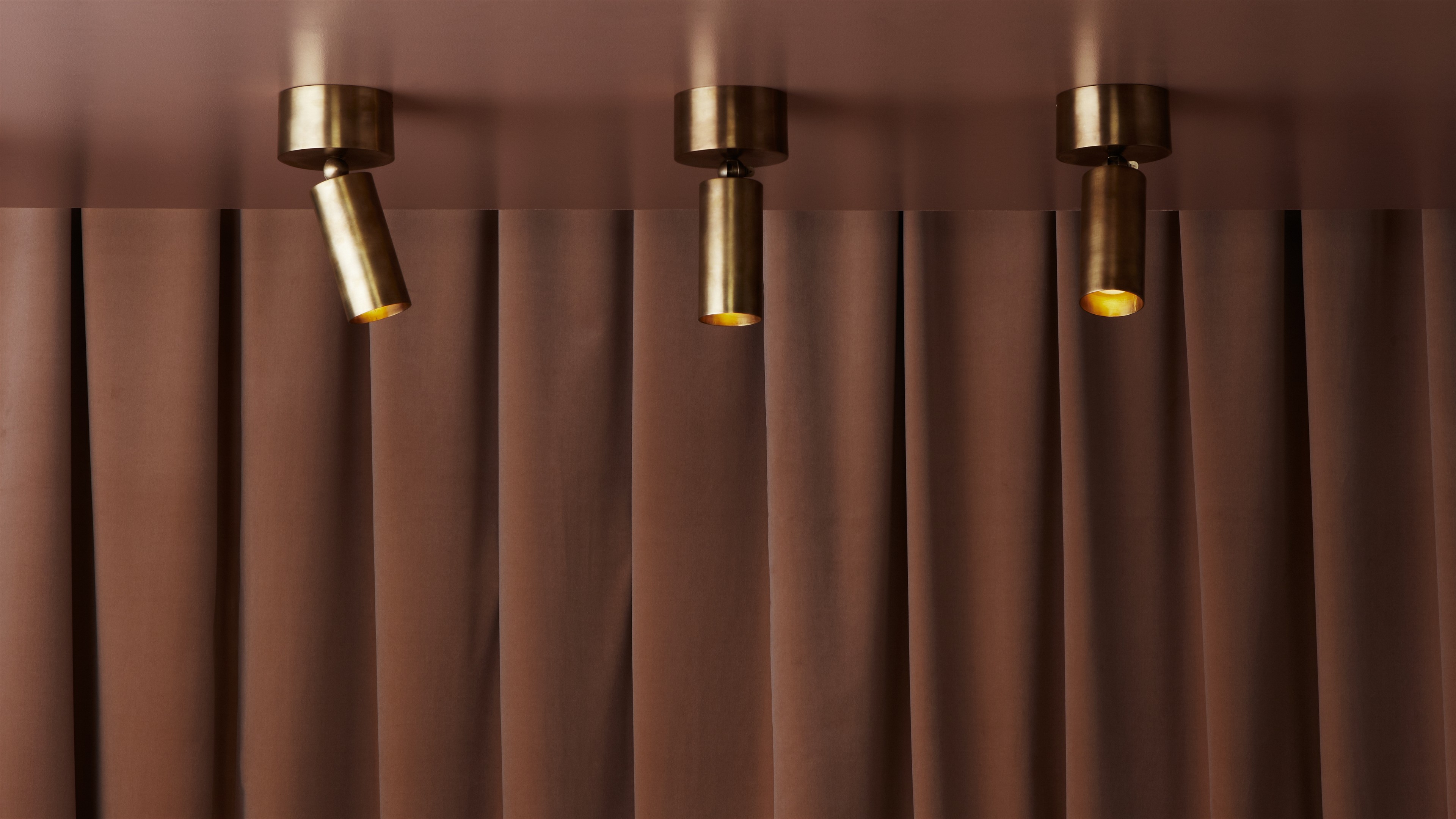 a row of lights hanging from the side of a curtain