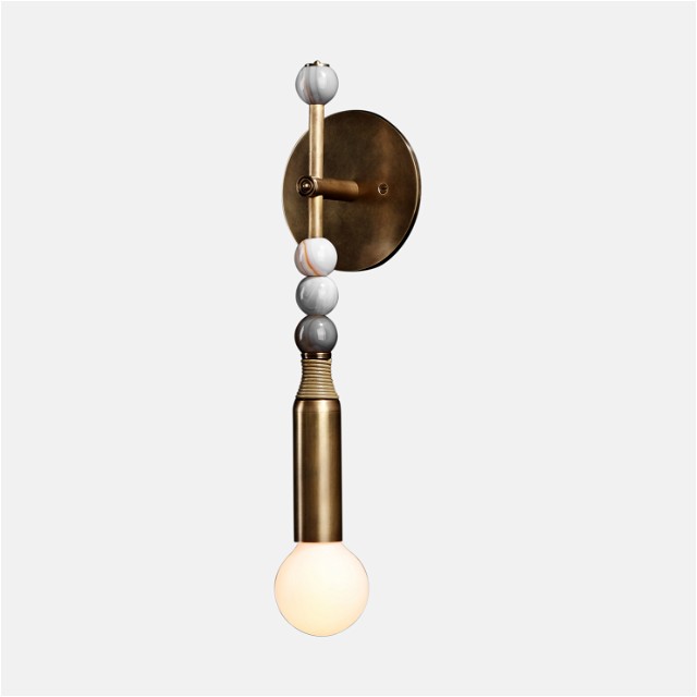a wall light with a white ball hanging from it