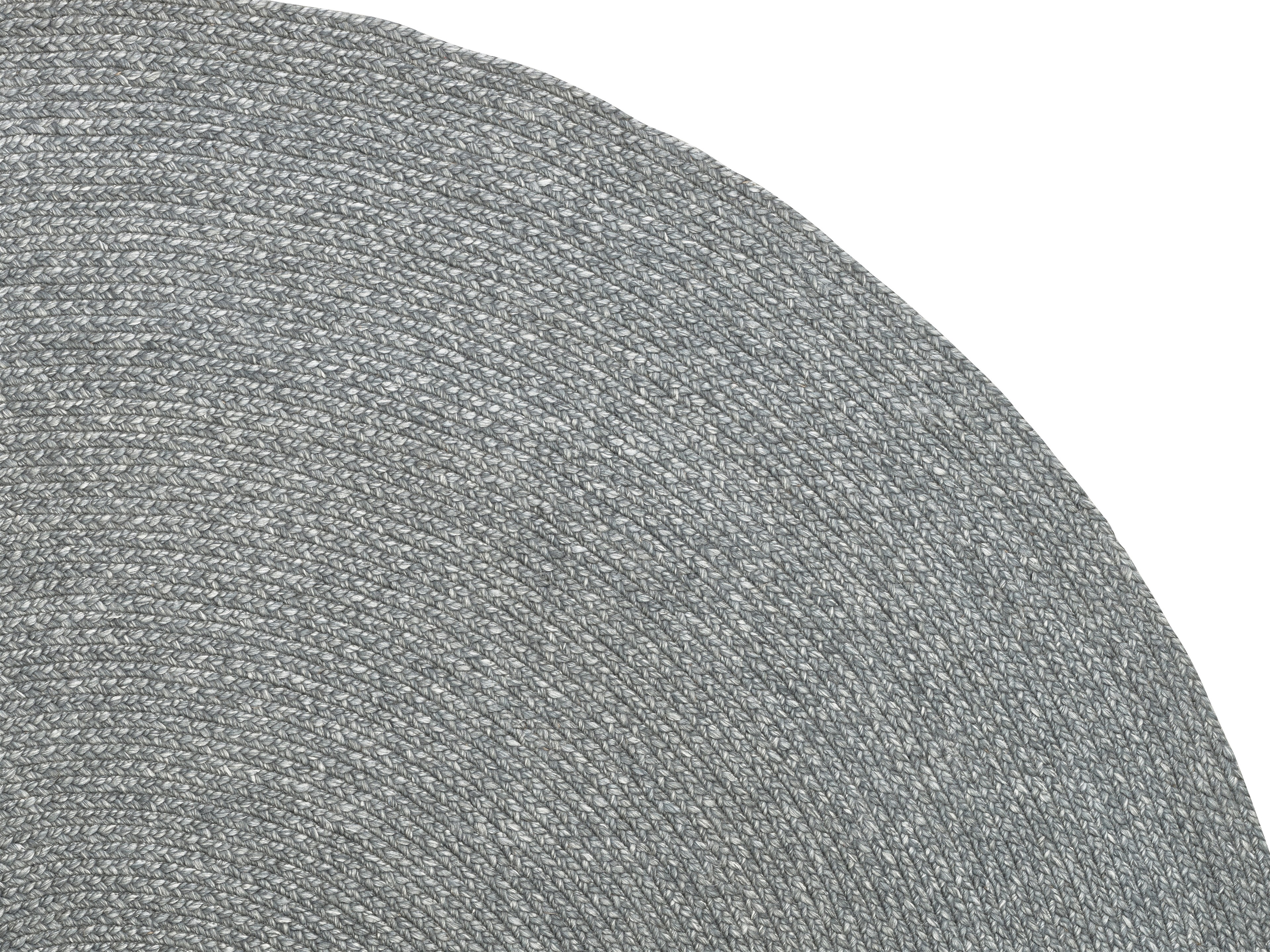 a close up of a gray rug on a white background