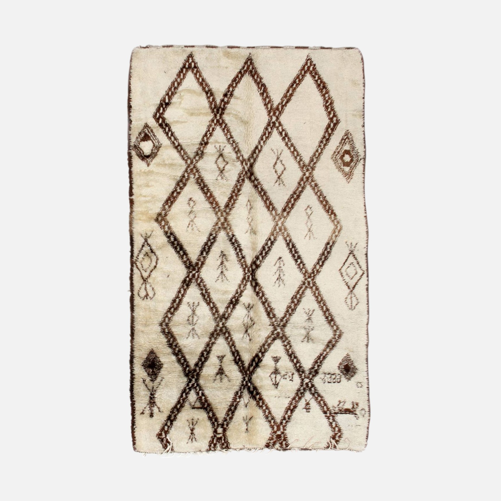 a white and brown rug with a diamond pattern