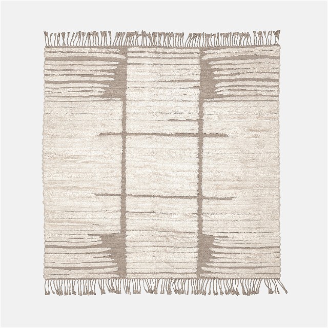 a white rug with fringes on it