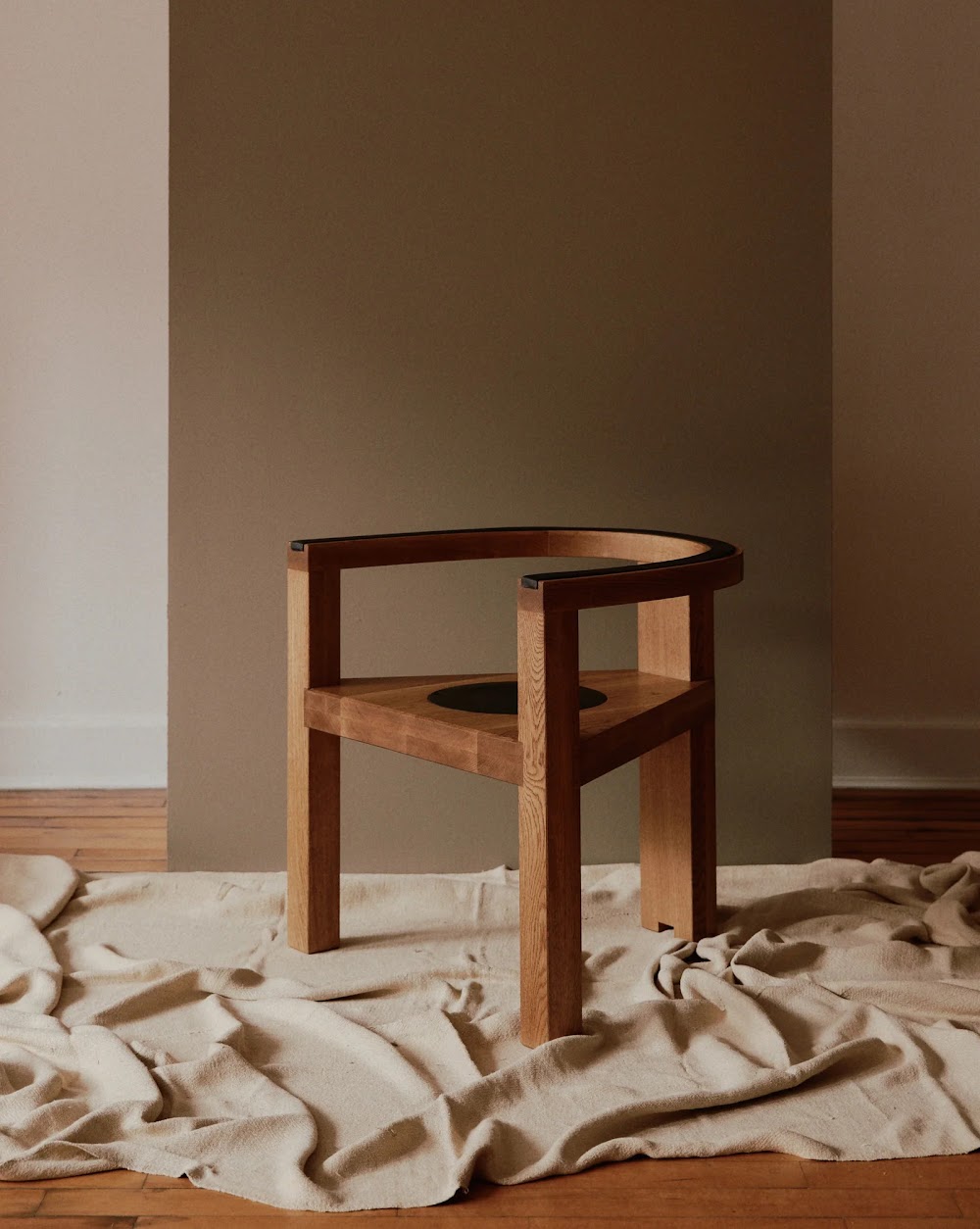 a wooden chair sitting on top of a wooden floor