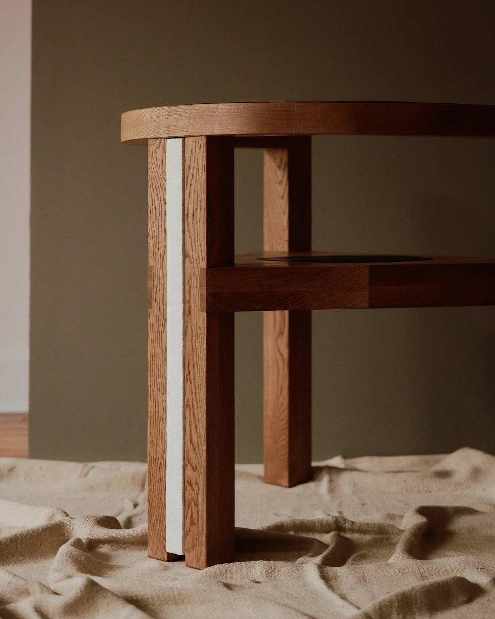 a close up of a wooden table on a bed